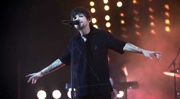 One Direction singer Louis Tomlinson reschedules in-store signing after breaking arm