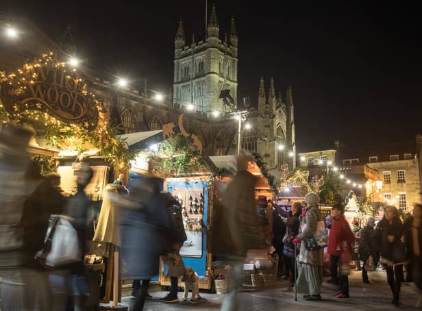 <p>Christmas shoppers browse stalls at the traditional Christmas market in Bath.</p>