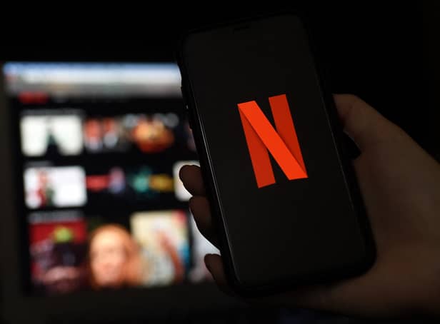 <p>In this photo illustration a computer and a mobile phone screens display the Netflix logo on March 31, 2020 in Arlington, Virginia. (Photo by Olivier DOULIERY / AFP) (Photo by OLIVIER DOULIERY/AFP via Getty Images)</p>