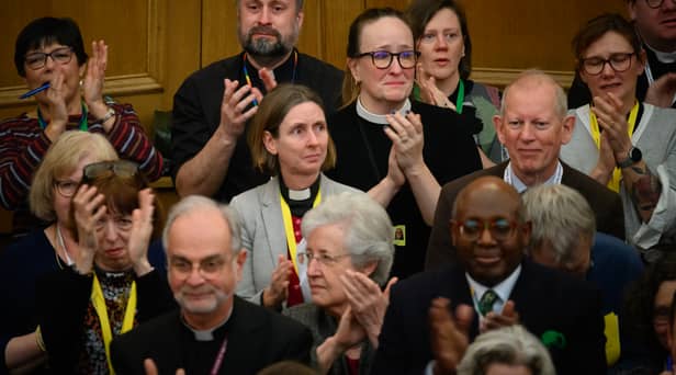 : Members of the General Synod react after blessings for same-sex couples was approved in a vote by the General Synod at The Church House.