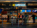 People purchase food in a branch of the bakery chain Greggs inside London Bridge station.