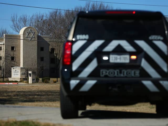 A police vehicle sits outside of the Congregation Beth Israel Synagogue in Colleyville, Texas, some 25 miles (40 kilometers) west of Dallas (Photo by Andy JACOBSOHN / AFP) (Photo by ANDY JACOBSOHN/AFP via Getty Images)