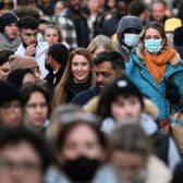 Shoppers, some wearing face-masks, walk along Oxford Street in central London (Getty Images)