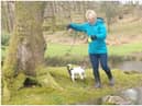 Murdered PCSO Julia James walking her Jack Russell Toby and wearing a light blue waterproof coat, blue jeans and dark coloured Wellington style brown boots - the same clothes she had on when last seen before her murder (Kent Police)