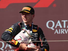 Max Verstappen holds the broken Hungarian Grand Prix trophy 