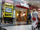  Shoppers walk past a Wilko store in Putney on September 12.