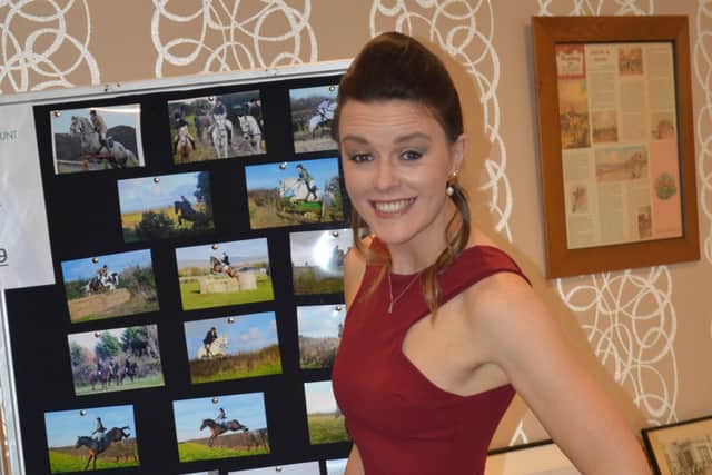 Rosie Alcorn viewing the photo display