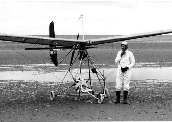 Ernie Patterson completes the re-enactment of the flight made by HarryFerguson in 1910, wearing white overalls just as Harry had done seventyyears before.