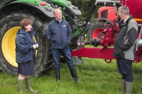 Agriculture Minister Edwin Poots MLA (right) and Economy Minister Diane Dodds MLA (left) with Co Tyrone man William Sayers.