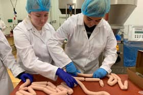National Diplma Students Chloe Hepburn (Castledawson) and Liza Hughes (Dungannon) develop their skills in sausage manufacture at Loughry Campus, as part of a sausage making competition to see which team could produce the best product.