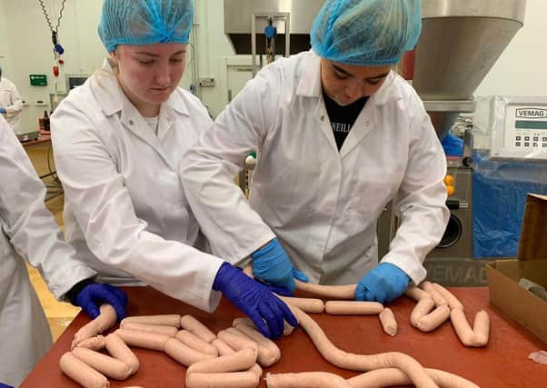 National Diplma Students Chloe Hepburn (Castledawson) and Liza Hughes (Dungannon) develop their skills in sausage manufacture at Loughry Campus, as part of a sausage making competition to see which team could produce the best product.