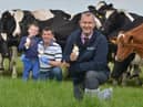 Minister Edwin Poots visited Hollowbridge Farm following the announement that the dairy and beef sector will get £25m in sopport to deal with the impacts of COVID19. Pictured  with farm owner Stephen Gibson and his 7 yr old son Stuart Gibson.Photo by Simon Graham.
