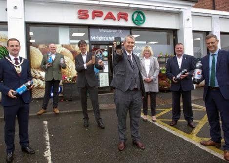 L-R: The Deputy Mayor, Cllr Andrew Wilson, Tony McGurk, founder of Cryptocycle, Eric Randall, Bryson director, Minister Edwin Poots, Dee and Jackie Wright, owners of the Whitehead Spar and Philip Thompson, MEA director of Operations.