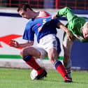 Linfield’s Hugh Dickson  gets to grips with Glentoran’s Andy Smith during the ‘Big Two’ match at The Oval in October 2002. Picture: Brian Little/News Letter archives