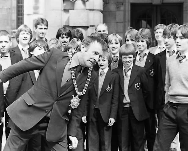 On the ball with pupils of Deramore School, Belfast, in September 1980 is Lord Mayor, Alderman John Carson, who had a game of headers with Graham McClure, 15, right, when the boys visited City Hall. The 23 pupils were leaving on September 11 for a two-week football tour in Duisberg, West Germany, where they were to play six matches against schools and football clubs. Picture: News Letter archives