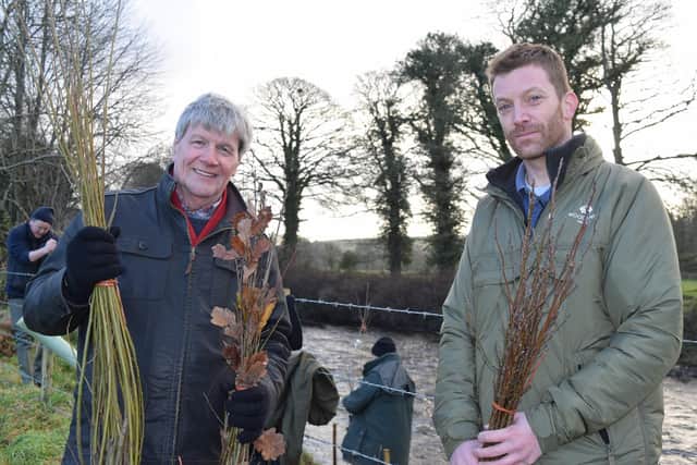 Dave Scott of the Woodland Trust and Joe Mahon prepare to plant some natiive trees on the bank sof the River Faughan
