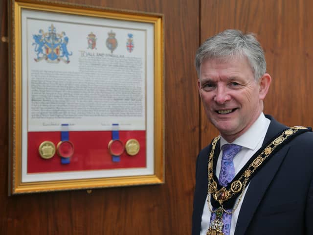 The Mayor of Causeway Coast and Glens Borough Council Alderman Mark Fielding pictured with the Letters Patent which is now on display in the Council Chamber in Cloonavin