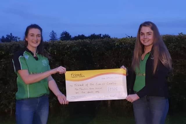 Rachel Rea and Kathryn Speers presenting ‘Friends of the Cancer Centre’ with a cheque of £2305.