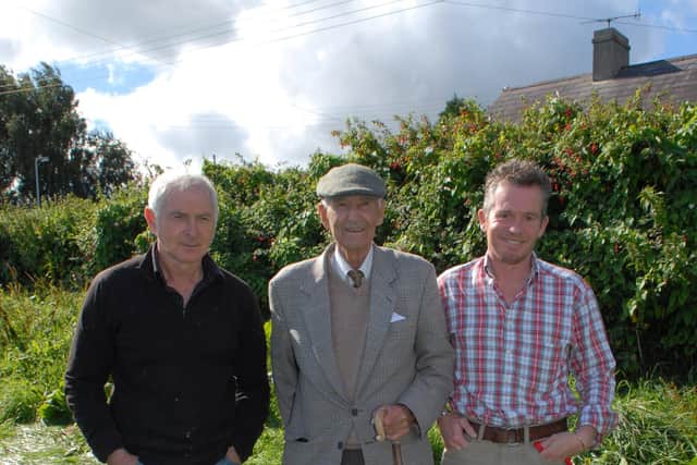 Robert Crawford, James Brady with Danny and Mike Field with Dice at the Cairncastle Sheepdog Trials in September 2010. Picture: Larne Times archive
