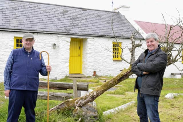 Dr Michael Healy and Joe at Holmes Farm on the banks of the Culdaff River