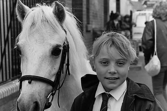 Pamela Morton, 10, keeps a firm rein on her pony Sally at the seventh annual Dromore Horse Fair which was held in the Co Down town in October 1989. Picture: Trevor Dickson/News Letter archives