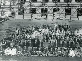 Some of those involved in the construction of Parliament Buildings at Stormont, Belfast. Does anyone recognise anyone in this old photo? Did anyone in your family help build Stormont? Get in touch, email: darryl.armitage@jpimedia.co.uk. Picture: News Letter archives