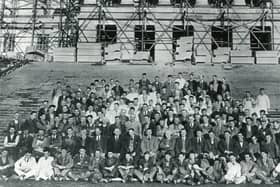 Some of those involved in the construction of Parliament Buildings at Stormont, Belfast. Does anyone recognise anyone in this old photo? Did anyone in your family help build Stormont? Get in touch, email: darryl.armitage@jpimedia.co.uk. Picture: News Letter archives