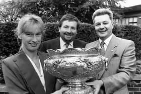 Roadferry sales manager Nicola Walker holding the Roadferry League Cup when the company announced its continued sponsorship at a press conference at the Park Avenue Hotel in Belfast in October 1989. Also in the photograph are Alan Miles, Roadferry managing director, and Irish League secretary Mervyn Brown. Mr Miles, who revealed the “biggest-ever purse” offered in the Irish League soccer told the News Letter: “It's our fourth year sponsoring the competition and I feel we are getting value for money. This competition gives the B Division clubs a chance to meet the big boys and that's what cup football is all about.” He added: “I just hope a B Division side is good enough to take the cash. Looking at the draw, Ballyclare must be in with a good chance.” Picture: News Letter archives