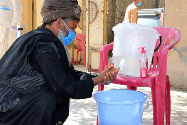 A man washes his hands before proceeding to a distribution of soap and food carried out by Christian Aid’s local partner in Badghis province, Afghanistan.

Credit: Christian Aid/Hasib Sadat.