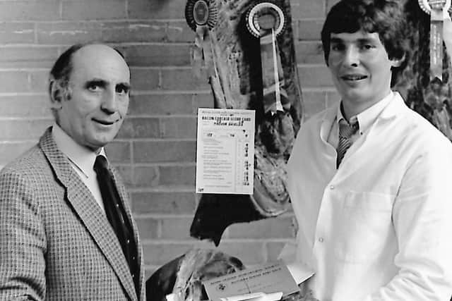 The bacon carcase champion in the autumn show and sale of pigs held at Balmoral in October 1989 was exhibited by Trevor Shields of Kilkeel, who received his award from Ivan Stockdale, manager of the pig testing station at Antrim. Picture: Randall Mulligan/Farming Life archives