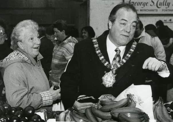 Belfast Lord Mayor Eric Smyth join shoppers at St George’s Market in Belfast after the news of a £3 million lottery cash grant in February 1996. Picture: News Letter archives