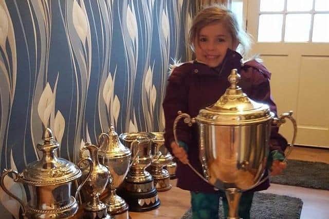 Tommy's granddaughter Tammi with Cups