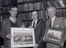Linen Hall librarian John Gray, left, presenting a print of the White Linen Hall, Belfast, to the Lord Mayor of Belfast Nigel Dodds in December 1988. The White Hall was demolished to make way for the City Hall. The First Citizen was on a visit to the historic library to hand over as a reciprocal gesture a Charter centenary commemorative picture of the civic citadel. With him was town clerk Cecil Ward. Picture: News Letter archives