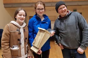 Trillick and District members Amy, Hannah and Colin with their bat box