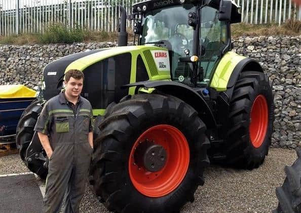 James Townley with a Claas Arion tractor during his Harper Adams 2013 placement year.