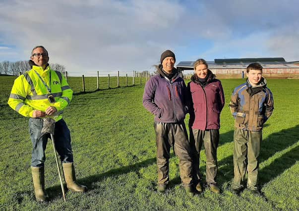 Greg Harken, Graduate Scientist from RPS pictured taking soil samples on the Bell farm in Co. Antrim along with Roger, Hilary & Scott Bell
