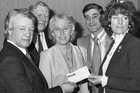 Billy Bingham presenting a cheque for £100,000 to Lady Dunleath, president of the Northern Ireland Council for Orthopaedic Development in February 1982. Included are Mr Jimmy James, chairman of NICOD, Mrs Thelma Greeves, organising secretary of NICOD, and Mr George Abbott from Bristol. Picture: News Letter archives