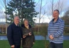 Howard and Deirdre Hilton being presented with their award from Dexter Cattle Society NI Representative Mike Frazer