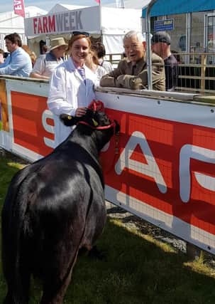Newell Bingham chats to Hannah Alexander at Balmoral Show 2019, who is leading a Ballykeel cow