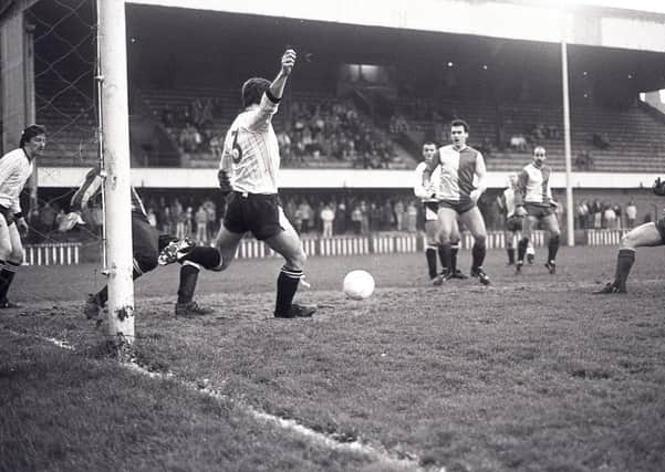 Crusaders defender Stephen Stewart clearing the ball from Cliftonville's Albert Holden during the Smirnoff Irish League game at Solitude in December 1988. Cliftonville were the victors by 1-0. Picture: News Letter archives