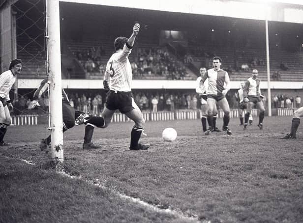 Crusaders defender Stephen Stewart clearing the ball from Cliftonville's Albert Holden during the Smirnoff Irish League game at Solitude in December 1988. Cliftonville were the victors by 1-0. Picture: News Letter archives