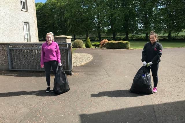 Ruth Dick and Rebecca Speers out litter picking the local roads