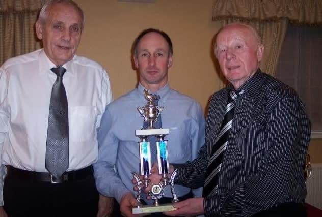 Ballymena President Billy Smyth presents the Visitors Show Trophy to Brian Herbinson, also included, Jimmy Letters from Harryville.