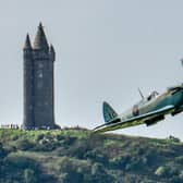 A Spitfire flies close to Scrabo Tower in Newtownards in September 2020. Picture: Simon Graham