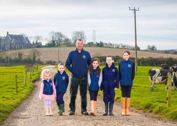 County Down Dale Farm farmer Chris Catherwood with children Lily (3), Tom (7), Molly May (8), Michael (10) and Kaitlyn (12)
