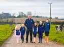 County Down Dale Farm farmer Chris Catherwood with children Lily (3), Tom (7), Molly May (8), Michael (10) and Kaitlyn (12)