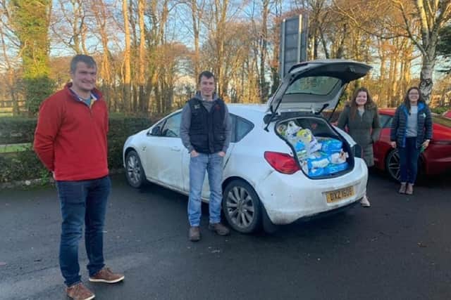Members of Kilraughts YFC with a car full of goodies for their local food bank