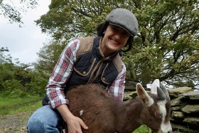 Isabella Rowatt with her goat on her farm in Donegal
