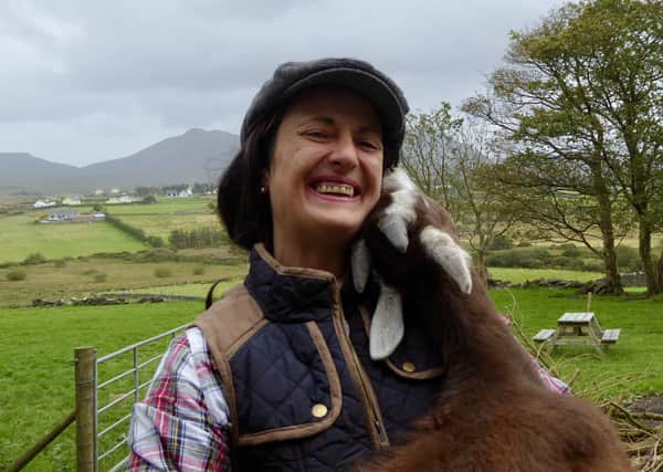 Isabella Rowatt and her goat on her farm in Donegal