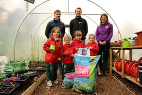 Primary 1 pupils from Friends’ Prep school in Lisburn help to launch the ‘Purple Potato Project’ an initiative set up by Lisburn-based social enterprise Kinder Garden Cooks which has joined with organics recycling firm Natural World Products (NWP) and Patch Seed Potatoes to encourage kids to ‘get growing’.  They are joined by, from left, Colm Warren of NWP, Alex McCreight of Patch Seed Potatoes and Sharon McMaster of Kinder Garden Cooks. The scheme will see 280 pupils across the Lisburn  area receive a bag of New Leaf Compost from NWP, which converts local household food and garden waste into organic, peat-free compost, and a newly-bred purple seed potato from Patch Seed Potatoes. The Purple Potato character is designed by artist Corrina Askin. Photography by Jude Rankin